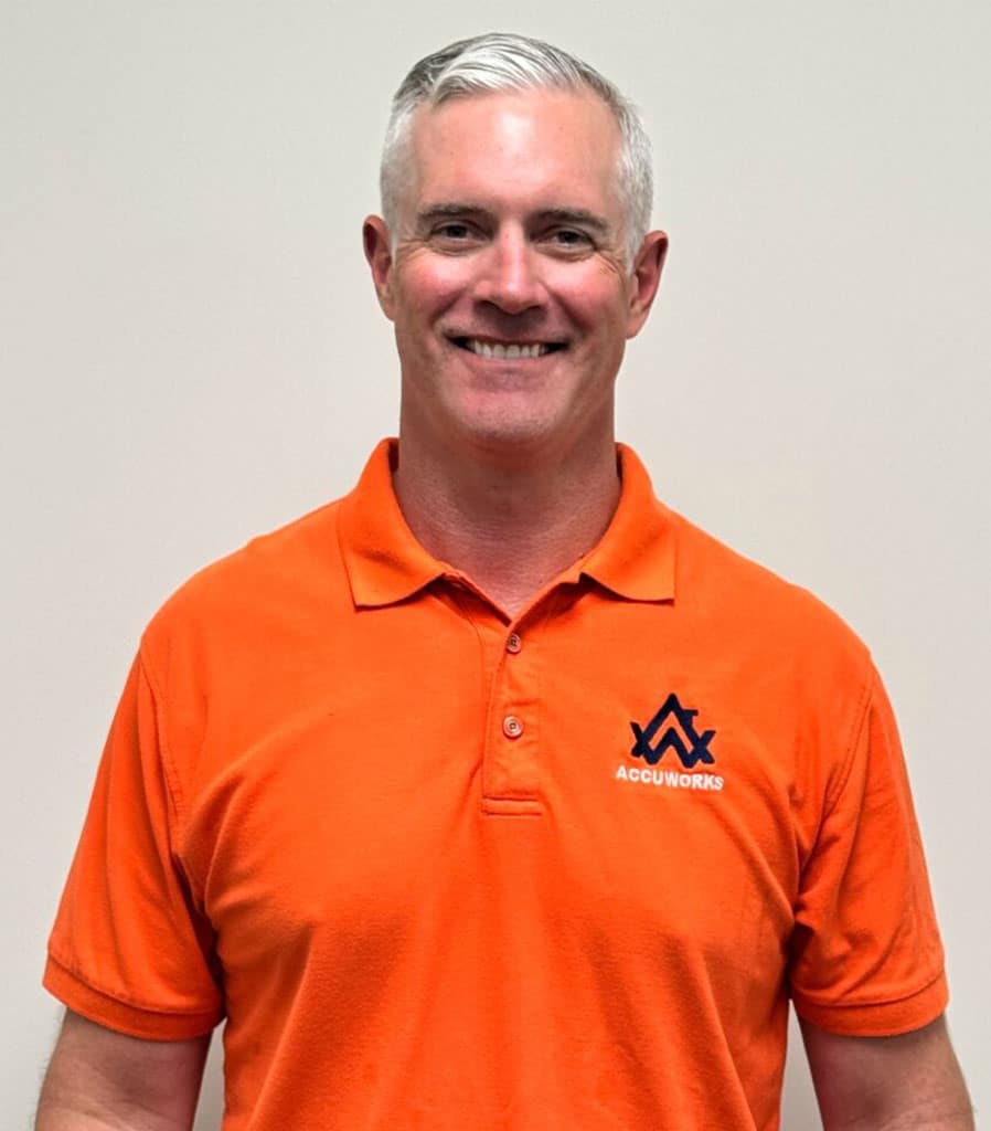 a man wearing an orange shirt
