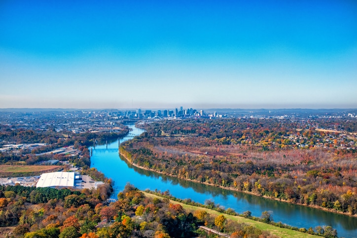 a large body of water with a city in the background